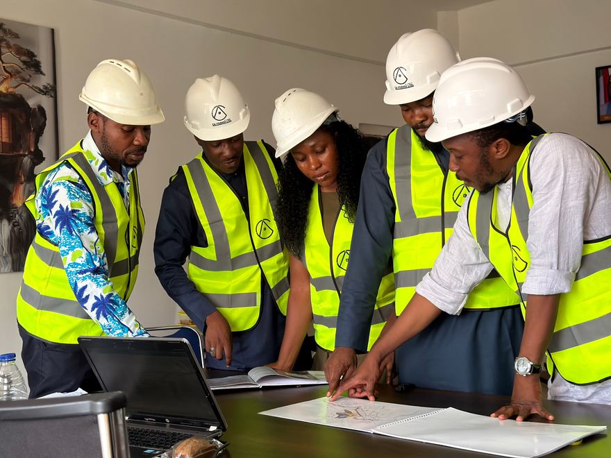 Team reviewing site drawings during a technical review